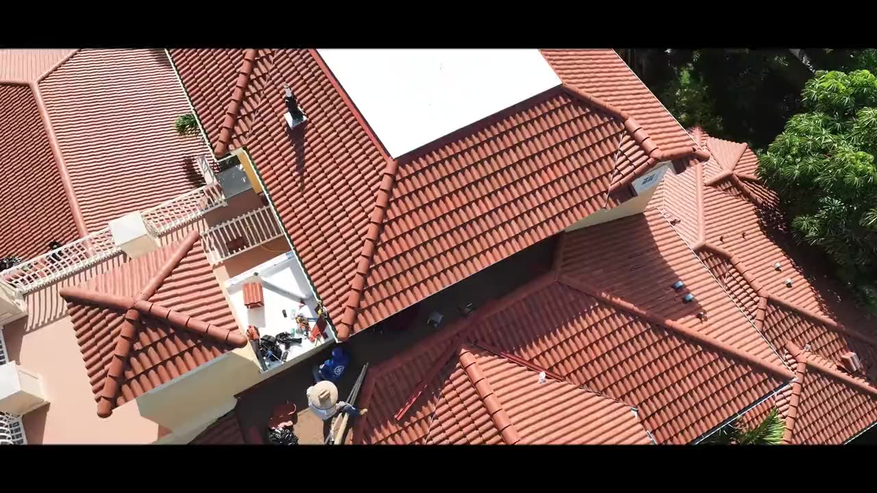 A finished tile roof from the air — press play to watch