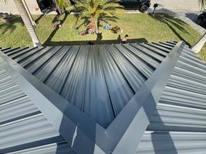 A new standing seam metal roof on a canal-front home