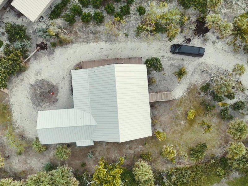 Aerial view of a new standing seam metal roof on an island home