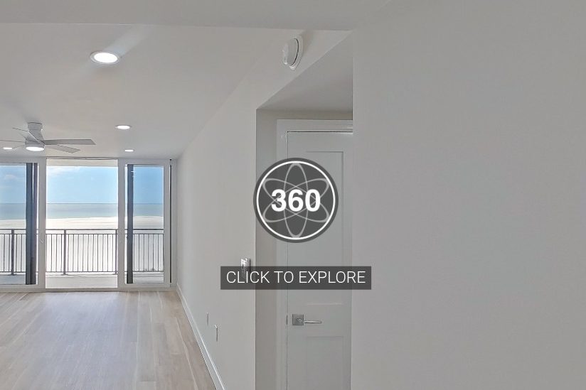 Inside a finished home on Marco Island, looking down the hall to a balcony and the beach